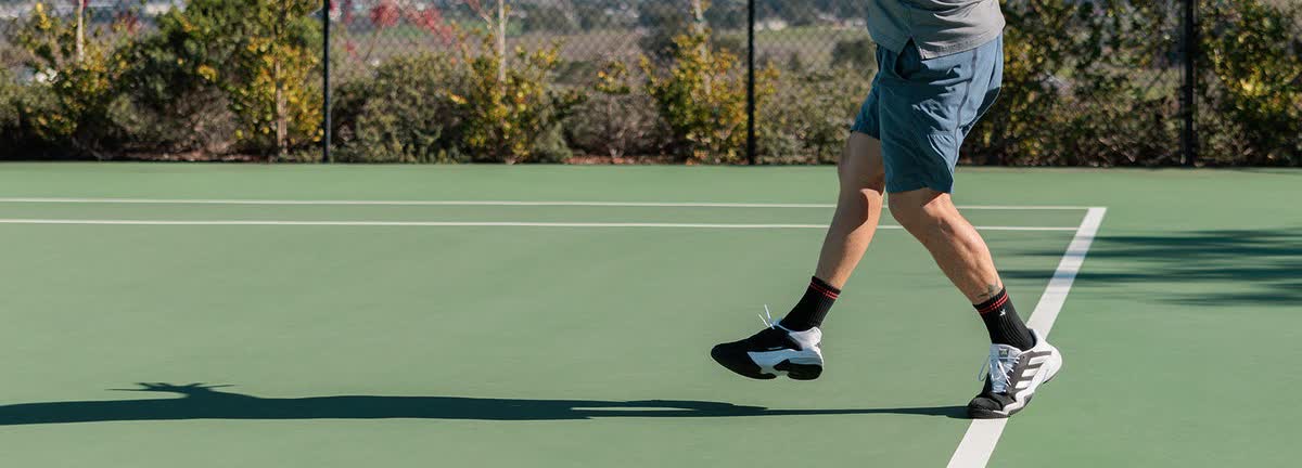 Checking the stiffness of a tennis shoe heel counter by hand