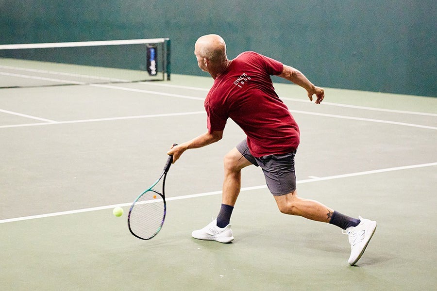 Wide fitting tennis shoes giving flat feet room to spread on court